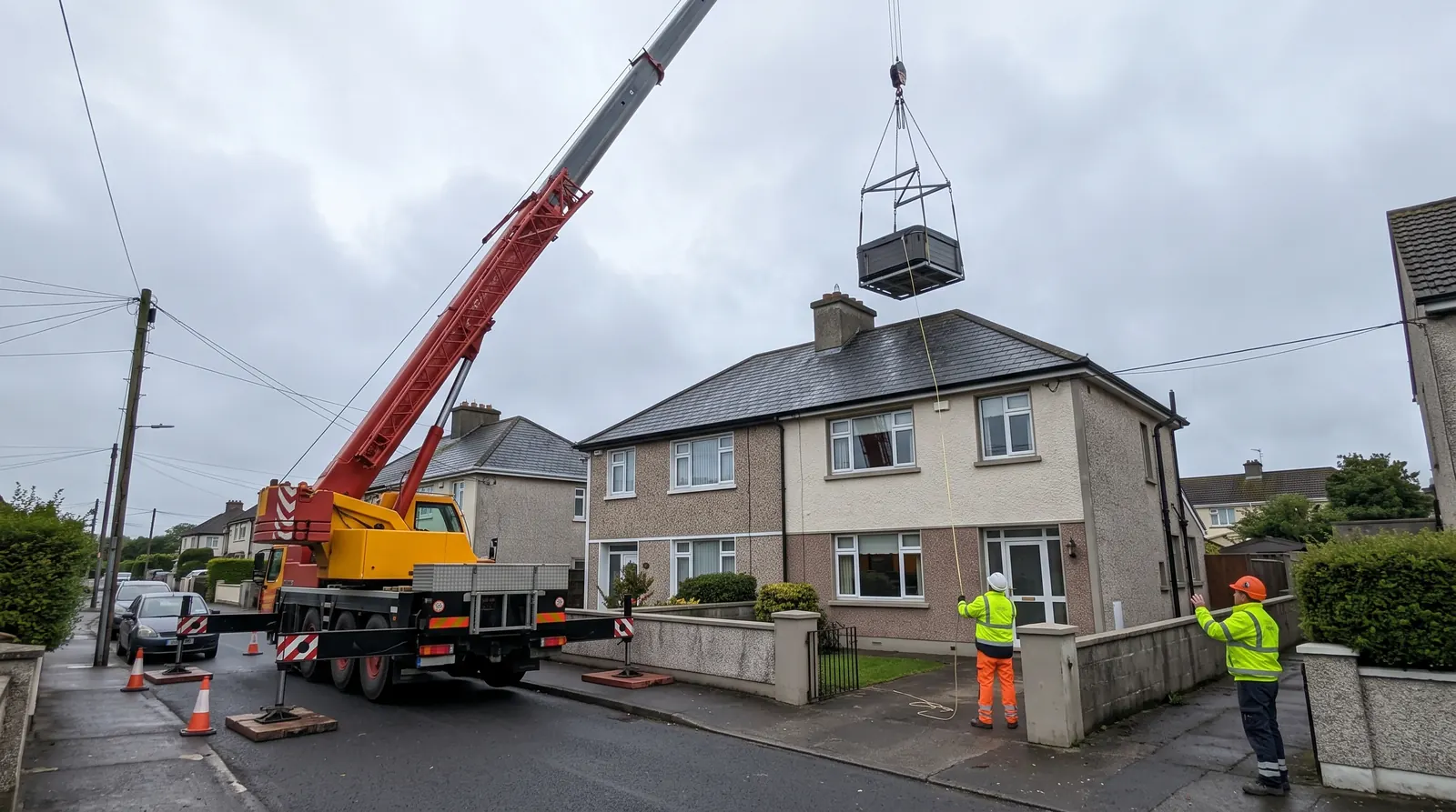 Crane lifting a hot tub over a house where there is no side access